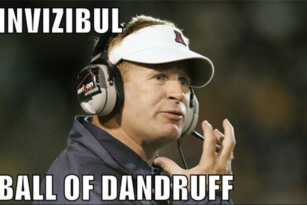 Arizona coach Mike Stoops seen here with friend. 